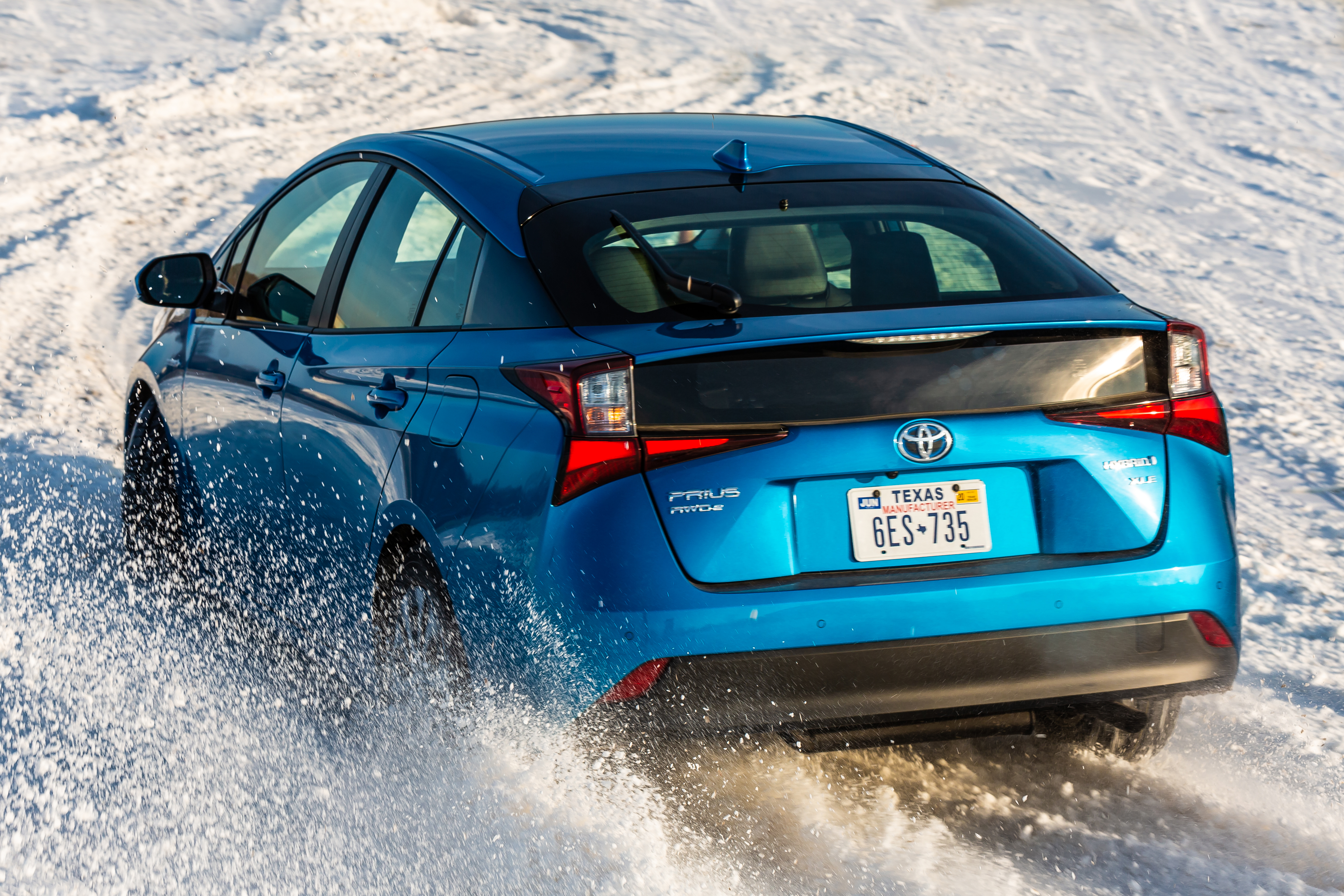 2019 Toyota Prius AWD digging into some snow.